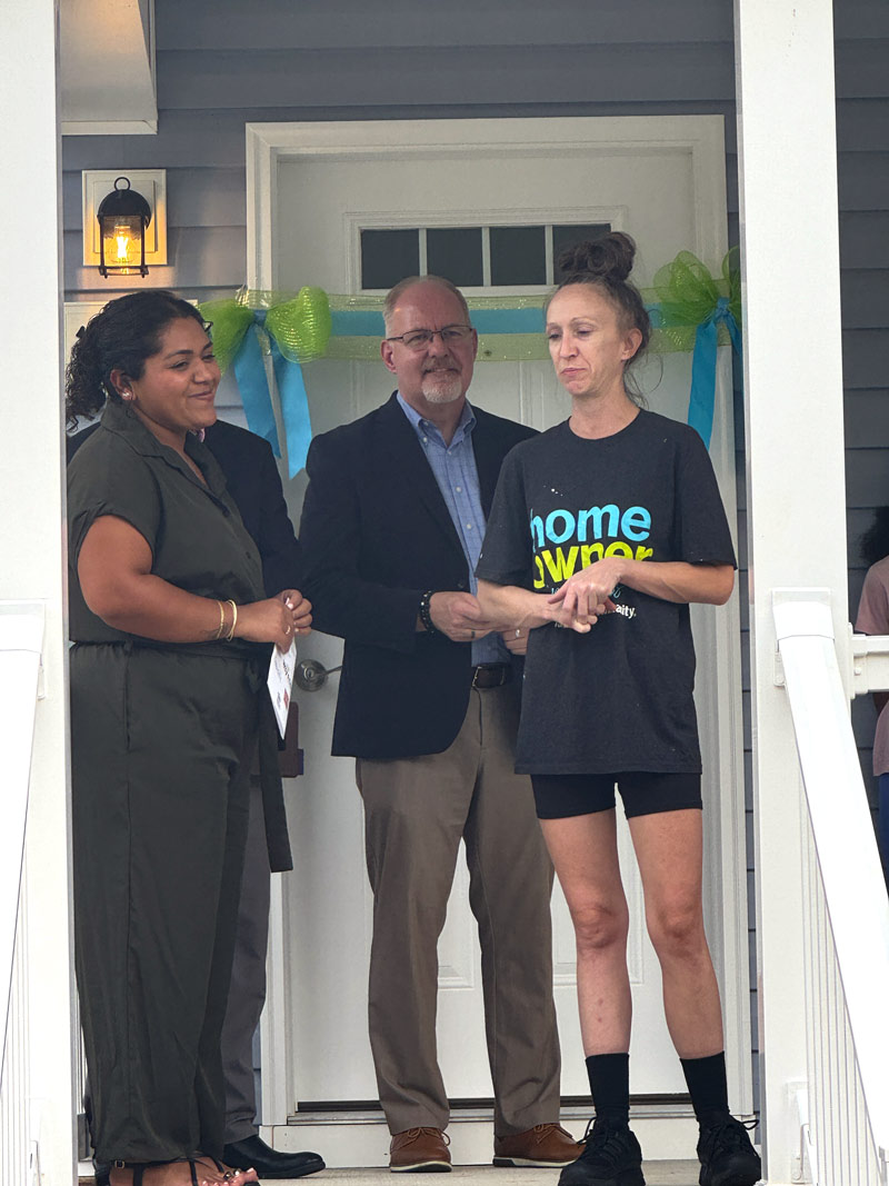 Ribbon cutting on a new Habitat for Humanity home.